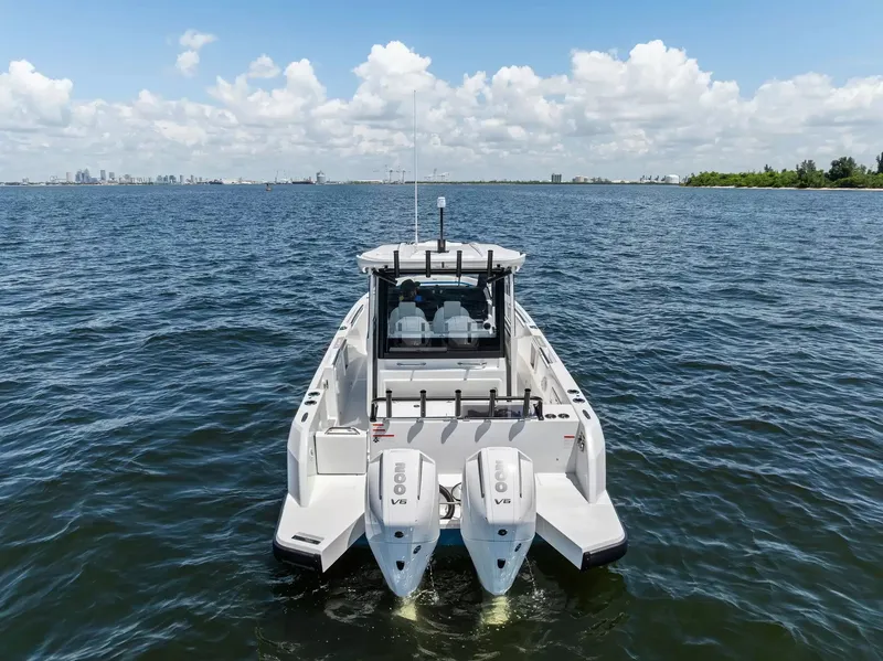 Slide: The Image of A 2027 Wellcraft 28 Explorer on open water with dual outboard engines. - 3