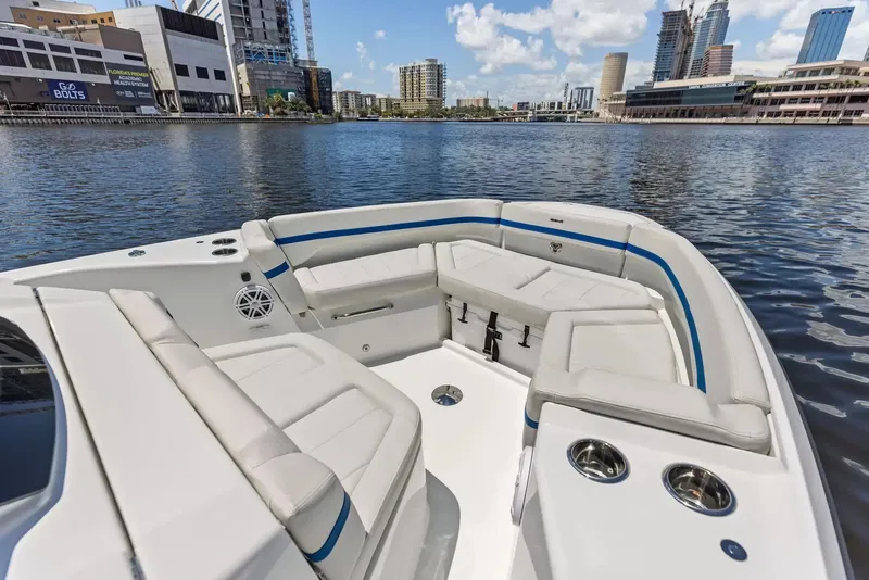 Slide: The Image of The image shows the bow of a 2027 Wellcraft 28 Explorer with comfortable seating and cup holders. - 29