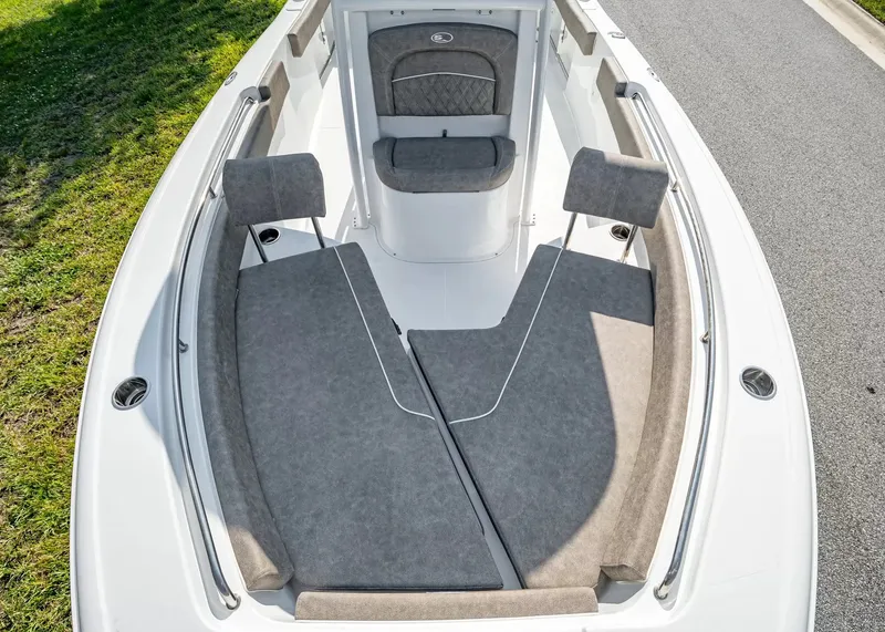 Slide: The Image of The image shows the bow area of a 2027 Sea Hunt Ultra 229 boat with gray cushions. - 16