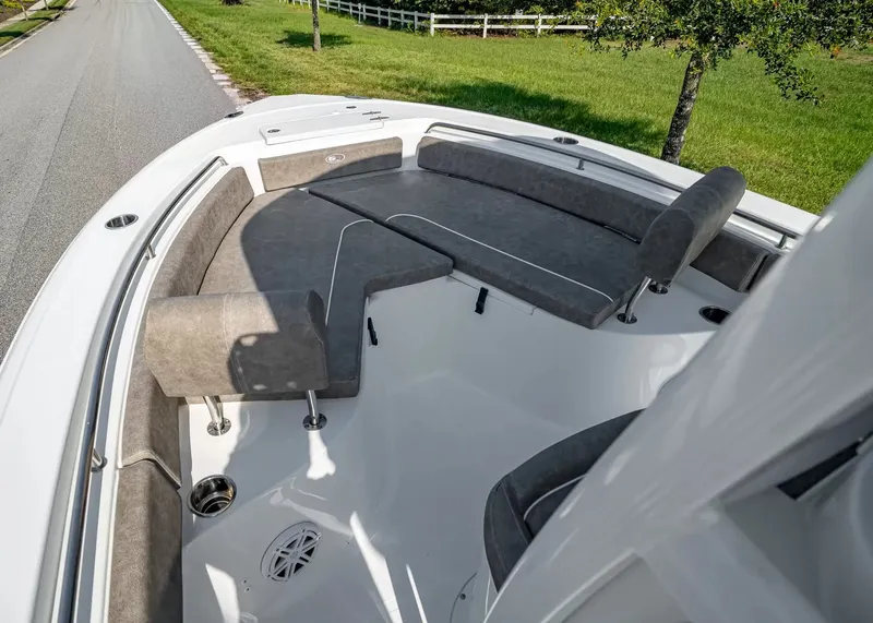 Slide: The Image of The image shows the bow area of a Sea Hunt Ultra 229 boat with gray cushions. - 15