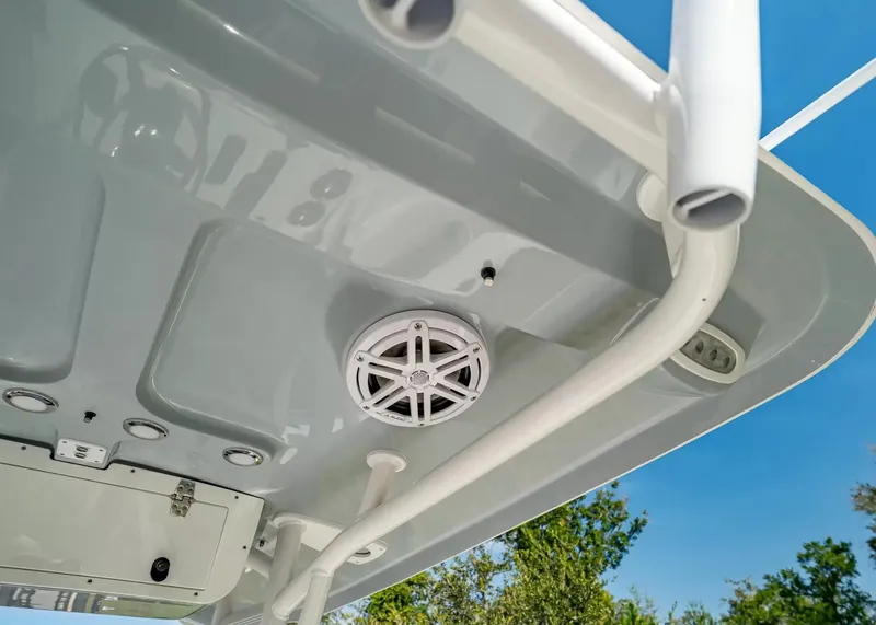 Slide: The Image of The image shows the roof of a Sea Hunt Ultra 229 boat with speakers and lights. - 9