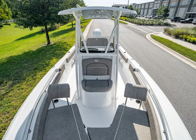 Slide: The Image of The image shows a 2027 Sea Hunt Ultra 229 boat with gray upholstery and a T-top. - 17