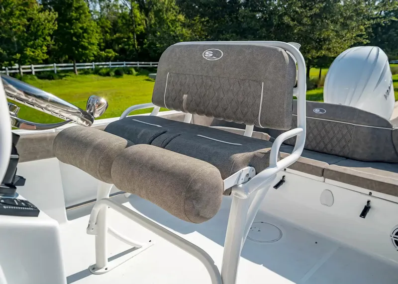 Slide: The Image of The image shows a cushioned seat on a 2027 Sea Hunt Ultra 229 boat. - 12