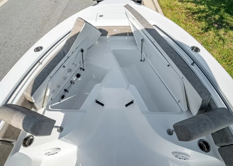 Slide: The Image of The image shows the bow of a Sea Hunt Ultra 229 boat with seating and storage. - 20