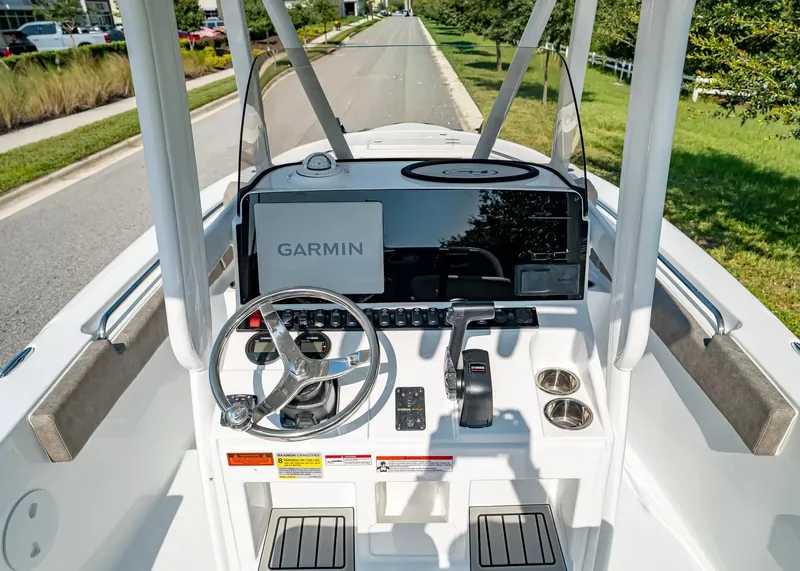 Slide: The Image of The image shows the cockpit of a Sea Hunt Ultra 229 boat with a Garmin navigation system. - 11