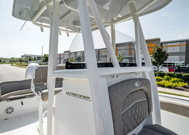Slide: The Image of The image shows the cockpit of a 2027 Sea Hunt Ultra 229 boat with gray seating. - 14