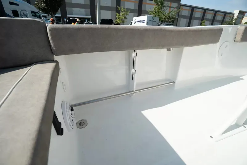Slide: The Image of The image shows the interior of a 2027 Sea Hunt Ultra 229 boat with gray upholstery. - 7