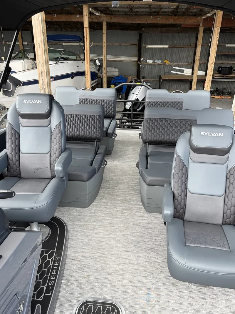 Slide: The Image of Interior of a 2027 Sylvan L3 RLZ Platinum with luxurious gray seating. - 7