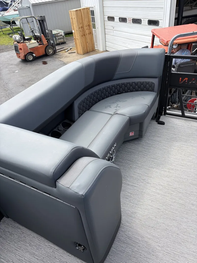 Slide: The Image of The image shows a luxurious gray seating area on a boat, surrounded by industrial equipment. - 14