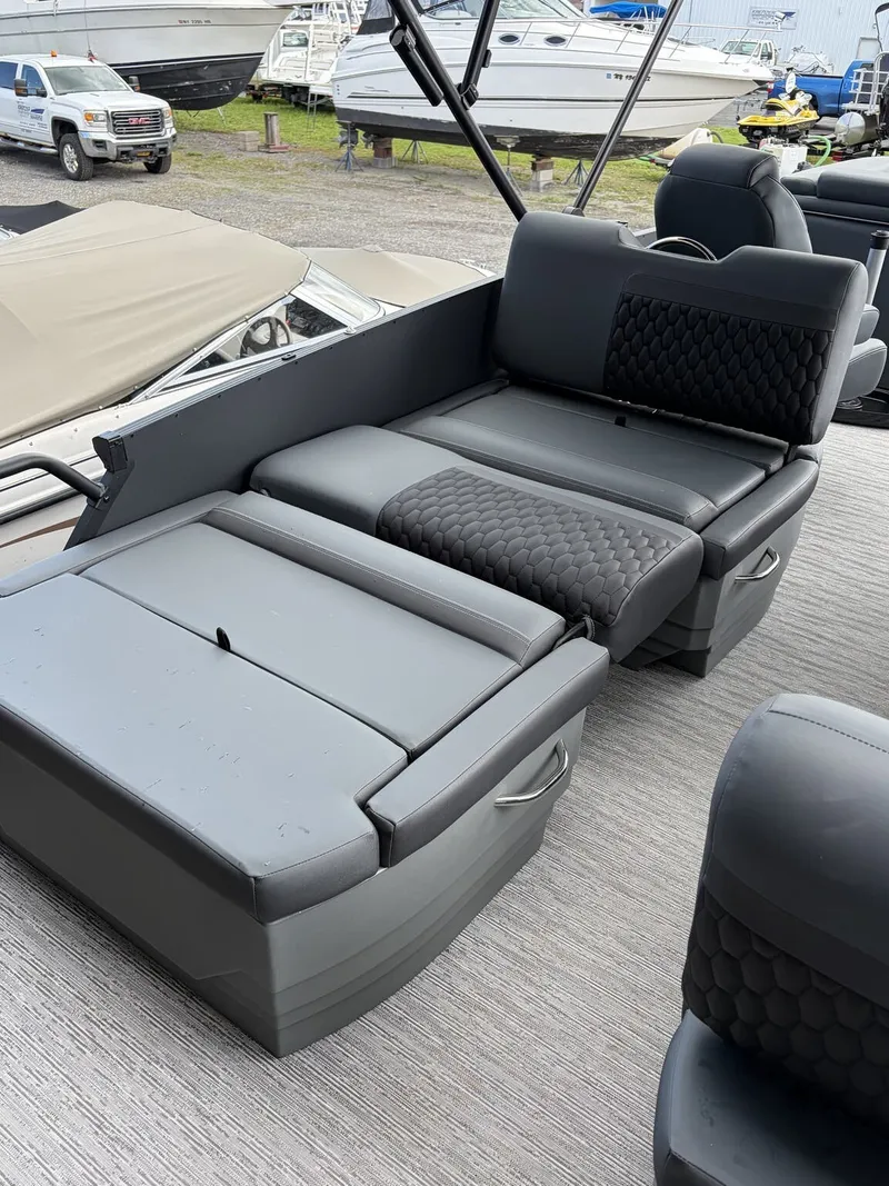Slide: The Image of The image shows the interior of a 2027 Sylvan L3 RLZ Platinum with gray upholstered seating. - 10