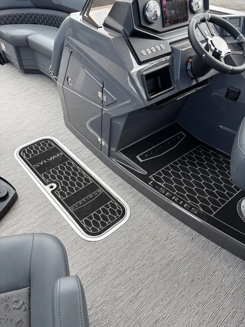 Slide: The Image of The image shows the cockpit of a 2027 Sylvan L3 RLZ Platinum with gray interior and modern instruments. - 11