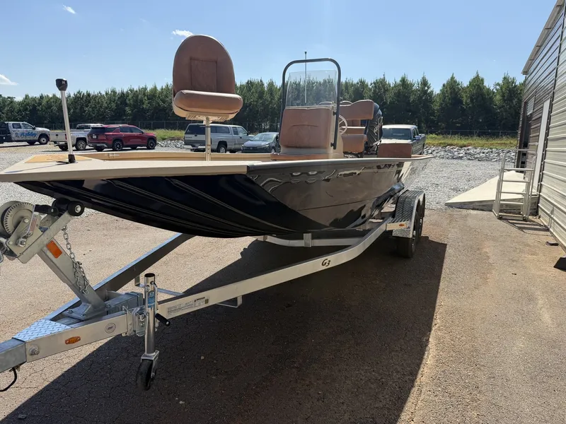 Slide: The Image of 2027 G3 Bay GX21 Tunnel-150HP SHO on a trailer, featuring brown seats and a steering console. - 3