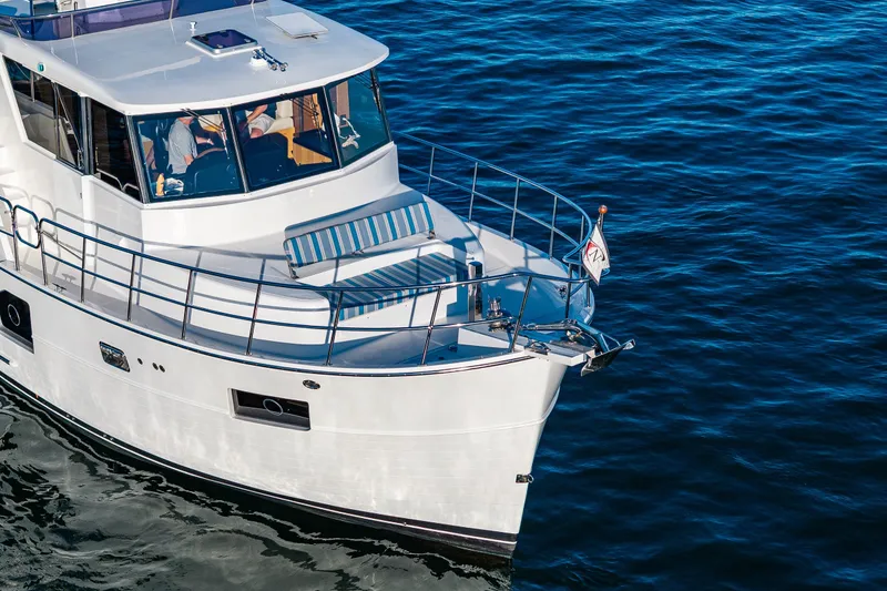 Slide: The Image of 2023 North Pacific 53 Euro yacht cruising on calm blue waters. - 93