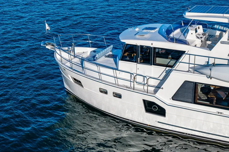 Slide: The Image of 2023 North Pacific 53 Euro yacht cruising on blue ocean waters. - 102