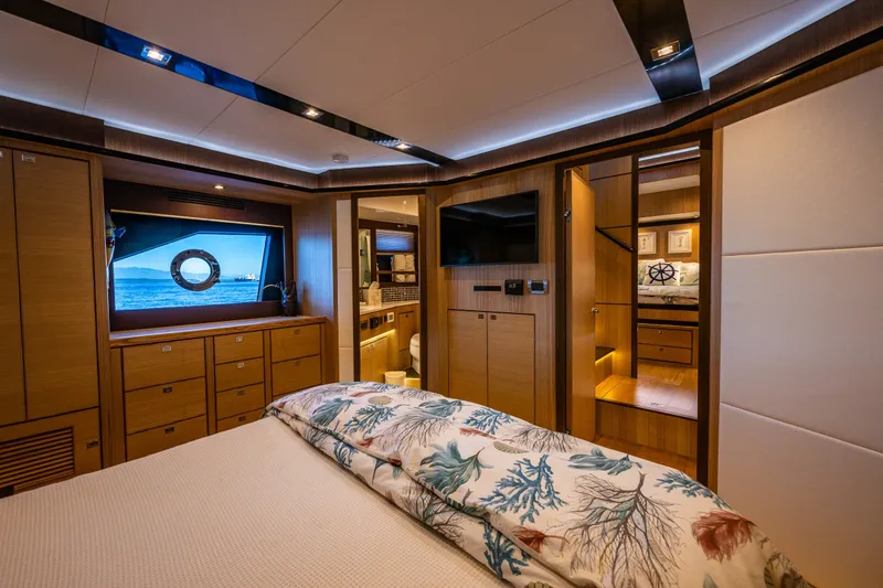 Slide: The Image of Luxurious interior of 2023 North Pacific 53 Euro yacht, featuring elegant wood finishes and modern amenities. - 34