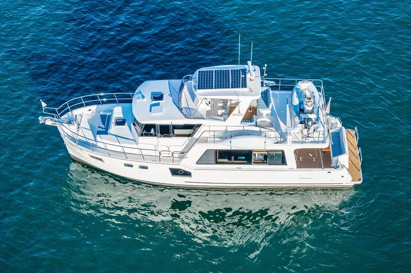 Slide: The Image of 2023 North Pacific 53 Euro yacht cruising on blue ocean waters. - 103