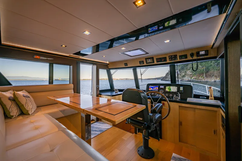 Slide: The Image of Luxurious interior of 2023 North Pacific 53 Euro yacht with panoramic windows and modern helm. - 20