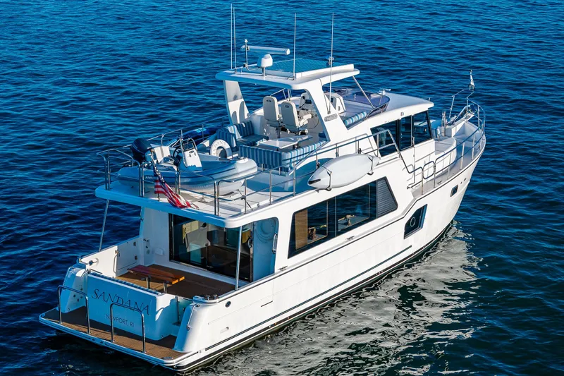 Slide: The Image of 2023 North Pacific 53 Euro yacht cruising on open water, showcasing sleek design and luxury features. - 96