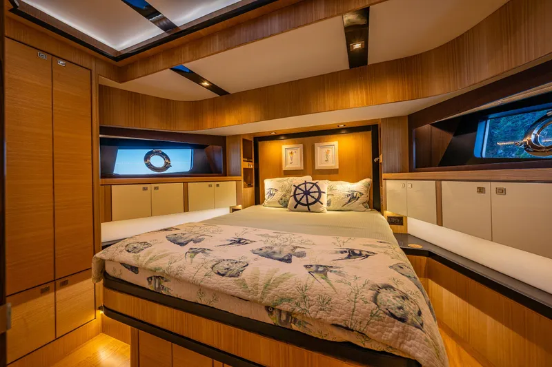 Slide: The Image of Luxurious 2023 North Pacific 53 Euro yacht bedroom with nautical decor and elegant wood finishes. - 41