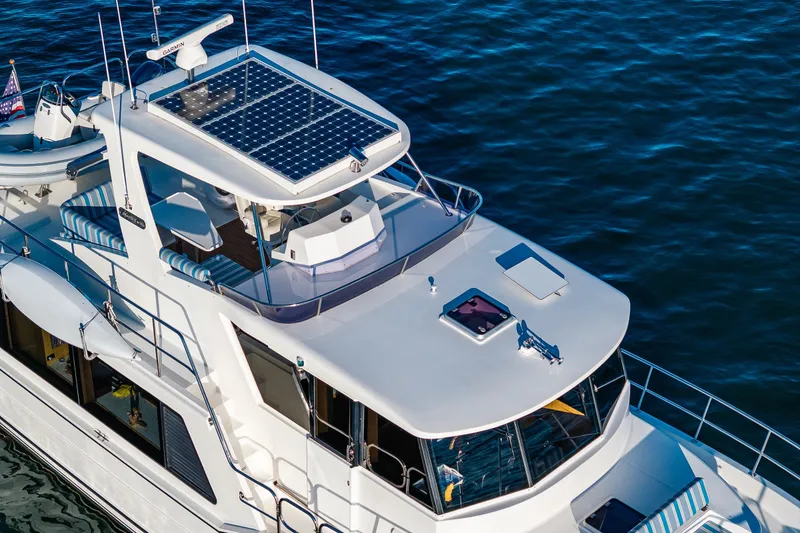 Slide: The Image of 2023 North Pacific 53 Euro yacht with solar panels on calm water. - 84