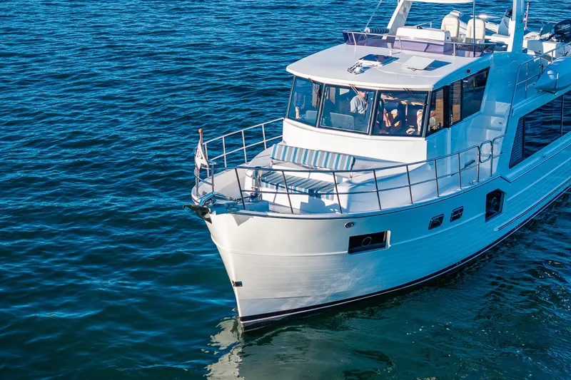 Slide: The Image of 2023 North Pacific 53 Euro yacht cruising on blue ocean waters. - 91