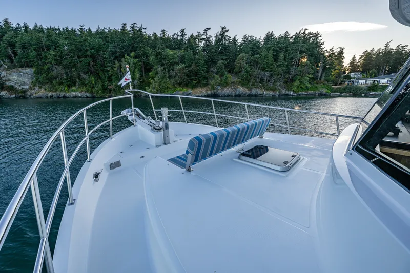 Slide: The Image of Bow view of 2023 North Pacific 53 Euro yacht, featuring sleek design and scenic water backdrop. - 62