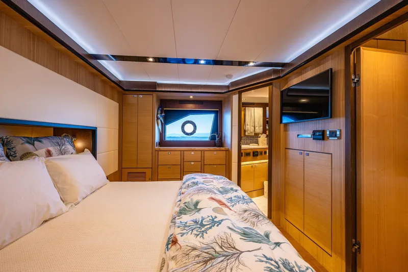 Slide: The Image of Luxurious cabin interior of 2023 North Pacific 53 Euro yacht, featuring elegant wood finishes. - 36