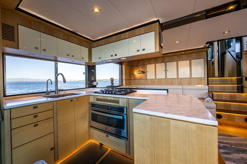 Slide: The Image of Luxurious kitchen interior of 2023 North Pacific 53 Euro yacht with ocean view. - 10
