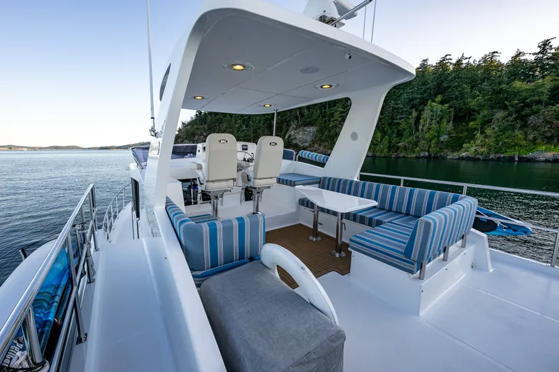 Slide: The Image of Luxurious 2023 North Pacific 53 Euro yacht with spacious deck and stylish seating. - 53