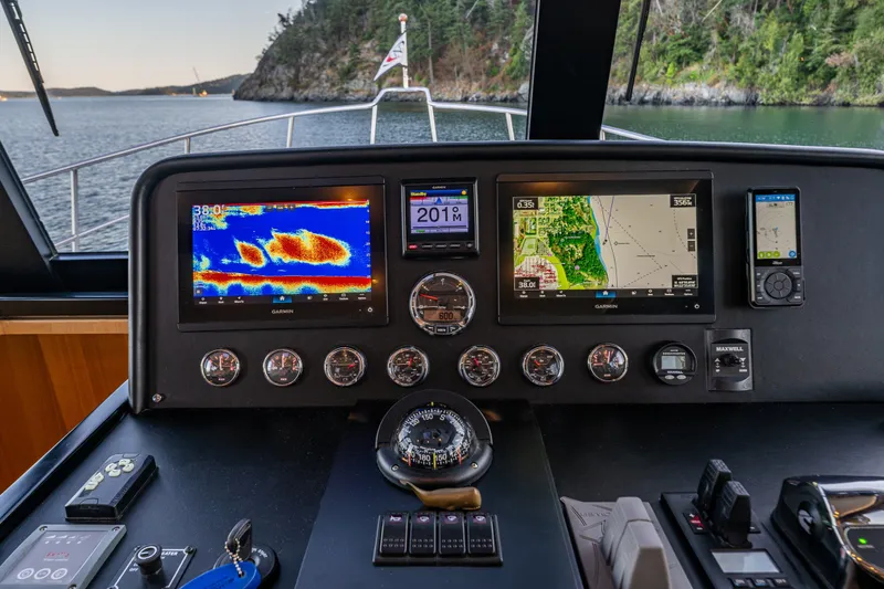 Slide: The Image of Cockpit of 2023 North Pacific 53 Euro yacht with navigation displays and controls. - 23