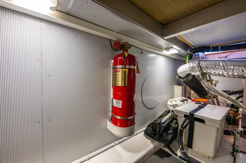 Slide: The Image of Engine room of 2023 North Pacific 53 Euro yacht with fire extinguisher and equipment. - 82
