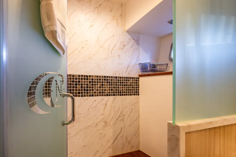 Slide: The Image of Luxurious bathroom interior of 2023 North Pacific 53 Euro yacht with elegant marble and glass design. - 50