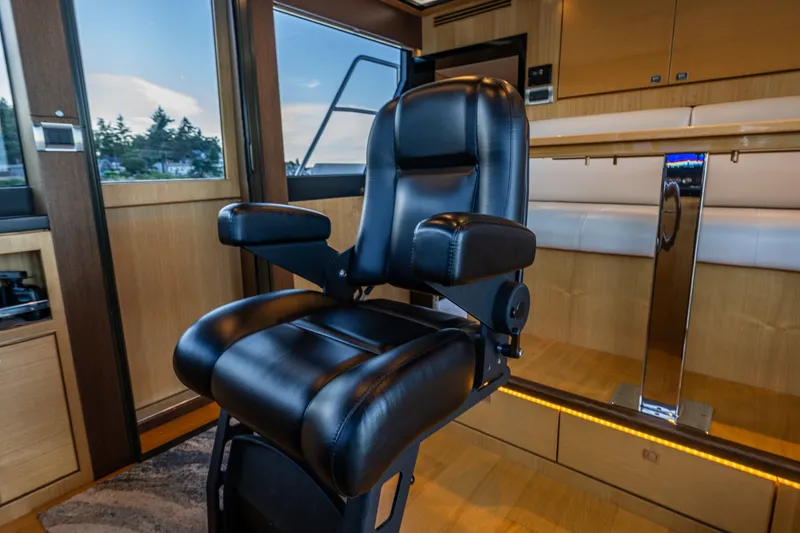 Slide: The Image of Luxurious captain's chair in 2023 North Pacific 53 Euro yacht interior. - 25