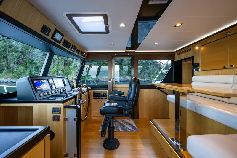 Slide: The Image of Luxurious interior of 2023 North Pacific 53 Euro yacht with modern helm and seating. - 28