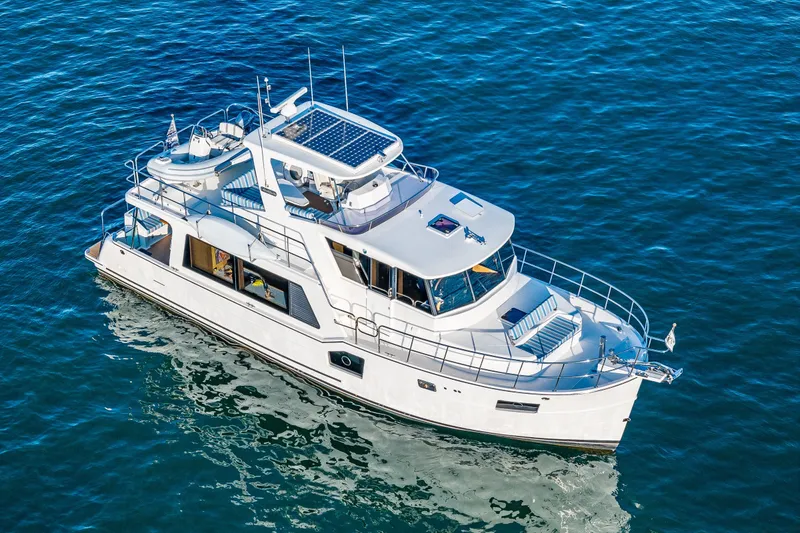 Slide: The Image of 2023 North Pacific 53 Euro yacht cruising on blue ocean waters. - 94