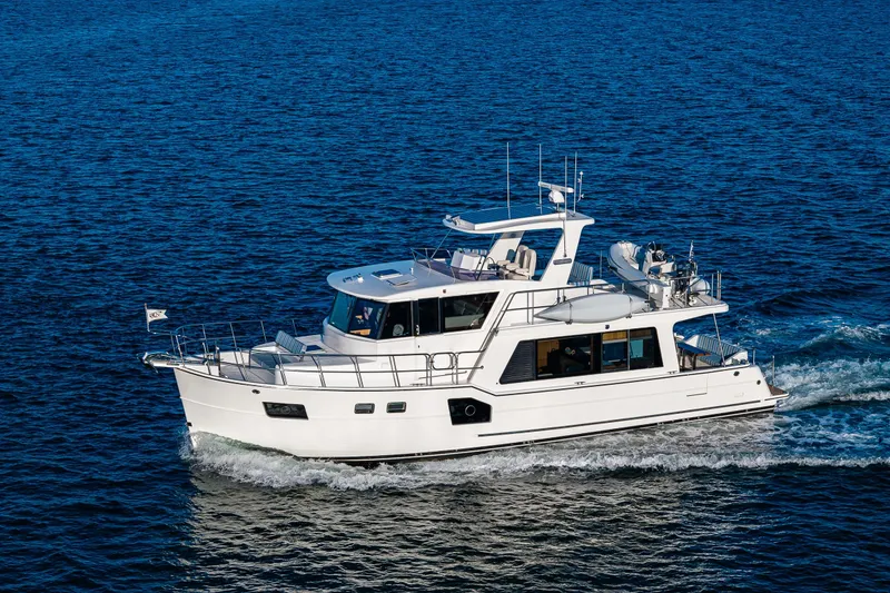 Slide: The Image of 2023 North Pacific 53 Euro yacht cruising on open blue water. - 107
