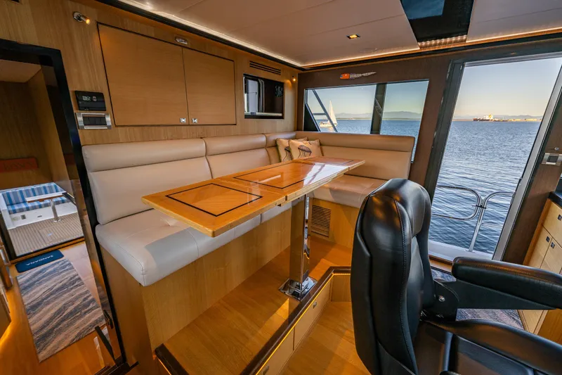 Slide: The Image of Luxurious interior of 2023 North Pacific 53 Euro yacht with elegant seating and ocean view. - 29