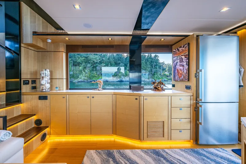 Slide: The Image of Luxurious interior of 2023 North Pacific 53 Euro yacht with modern kitchen and scenic window view. - 13