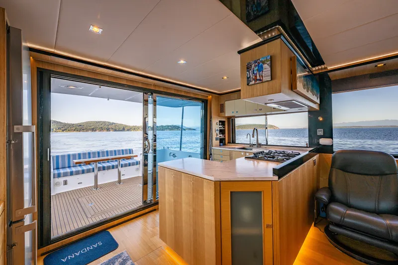 Slide: The Image of Luxurious interior of 2023 North Pacific 53 Euro yacht with ocean view and modern kitchen. - 8