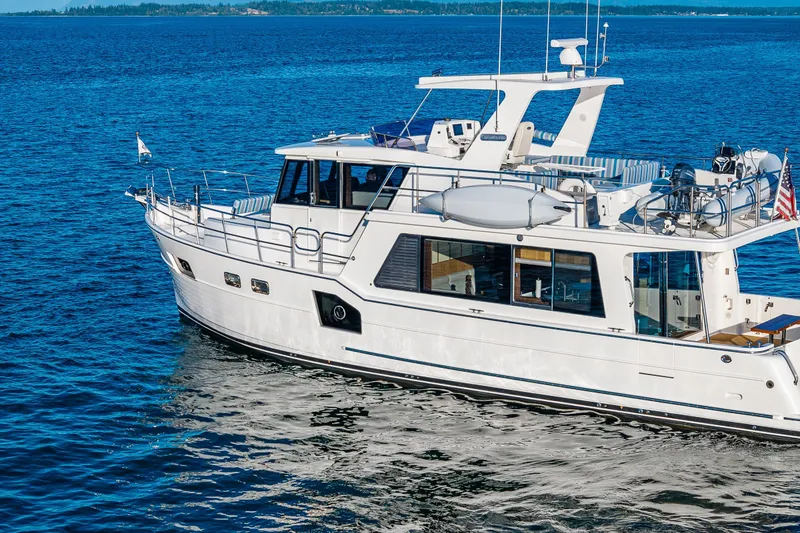 Slide: The Image of 2023 North Pacific 53 Euro yacht cruising on blue ocean waters. - 101