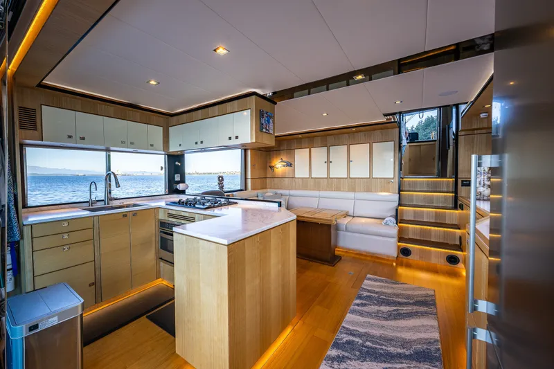 Slide: The Image of Luxurious interior of 2023 North Pacific 53 Euro yacht with modern kitchen and scenic ocean view. - 6