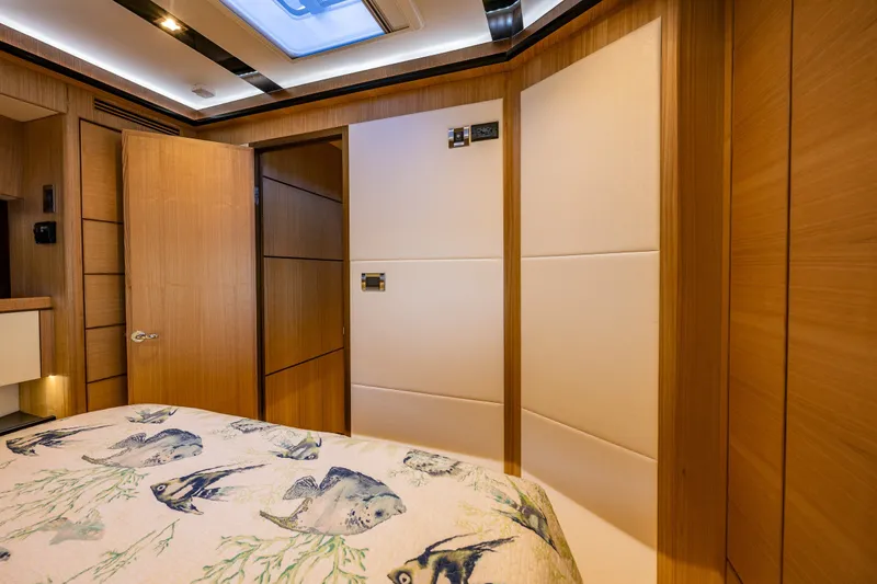 Slide: The Image of Luxurious cabin interior of 2023 North Pacific 53 Euro yacht with fish-patterned bedding. - 46