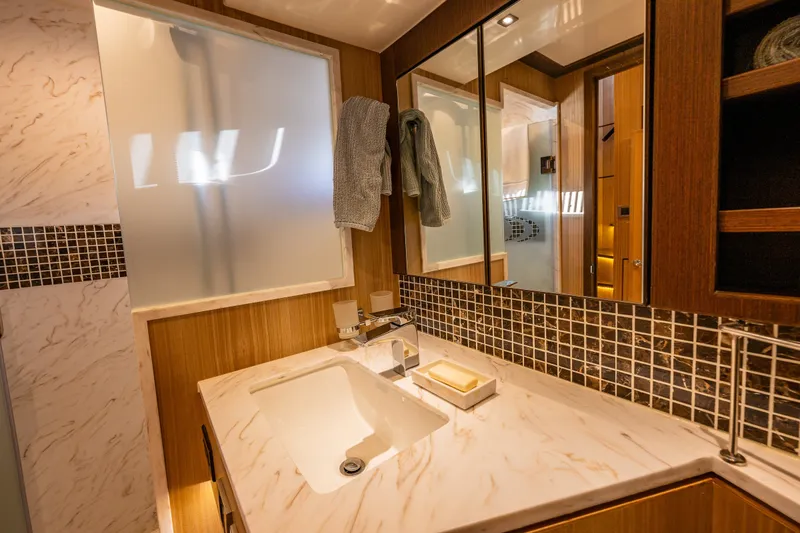 Slide: The Image of Luxurious bathroom interior of 2023 North Pacific 53 Euro yacht with elegant marble countertop. - 49