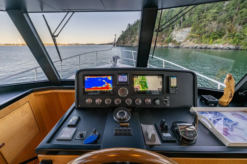 Slide: The Image of Cockpit view of 2023 North Pacific 53 Euro yacht with navigation equipment. - 22