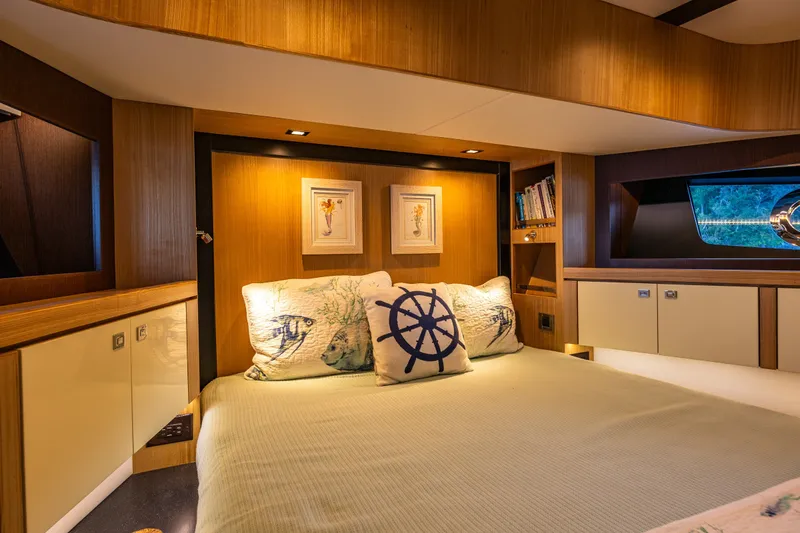 Slide: The Image of Luxurious cabin interior of 2023 North Pacific 53 Euro yacht, featuring elegant wood finishes. - 43