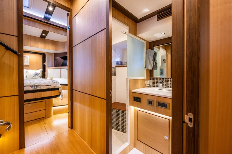 Slide: The Image of Luxurious interior of 2023 North Pacific 53 Euro yacht, featuring bedroom and bathroom. - 47