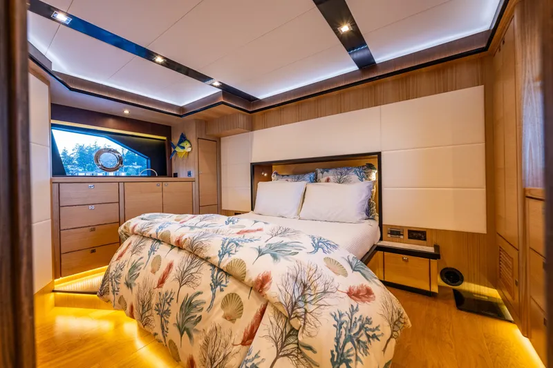 Slide: The Image of Luxurious bedroom interior of 2023 North Pacific 53 Euro yacht with elegant wood finishes. - 32