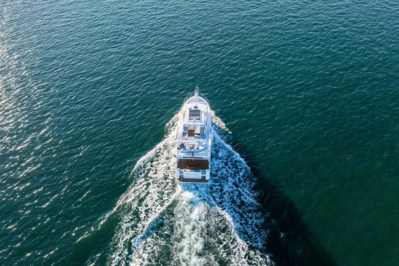 Slide: The Image of Aerial view of 2023 North Pacific 53 Euro yacht cruising on open water. - 3