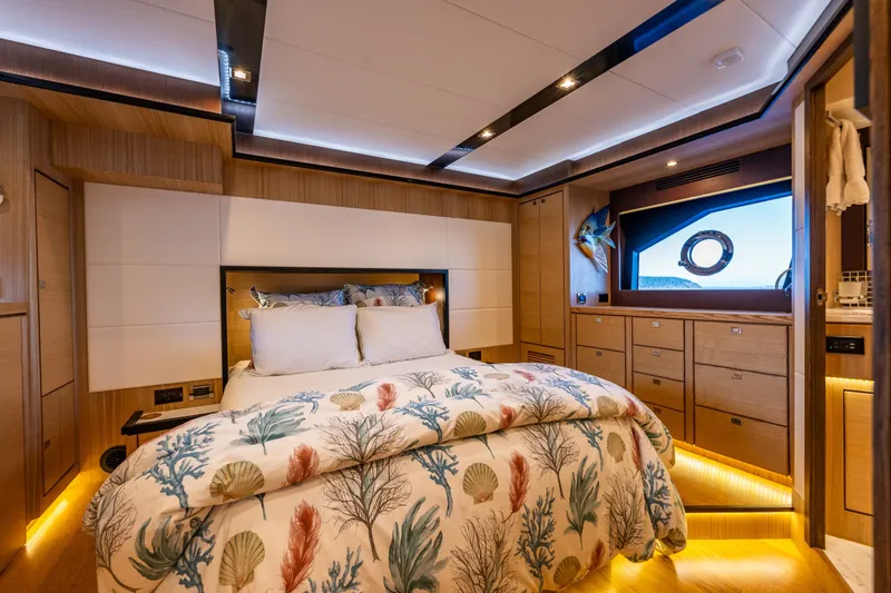 Slide: The Image of Luxurious 2023 North Pacific 53 Euro yacht bedroom with elegant decor and ambient lighting. - 31