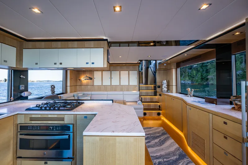 Slide: The Image of Luxurious interior of 2023 North Pacific 53 Euro yacht with modern kitchen and scenic views. - 9